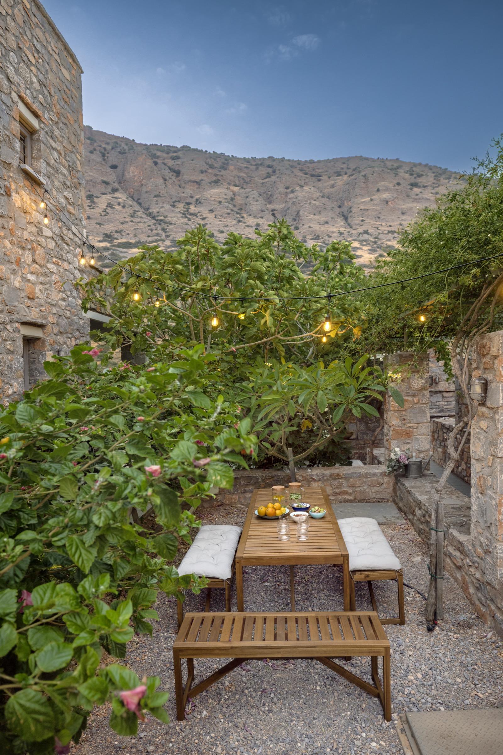 A table set in the courtyard at dusk