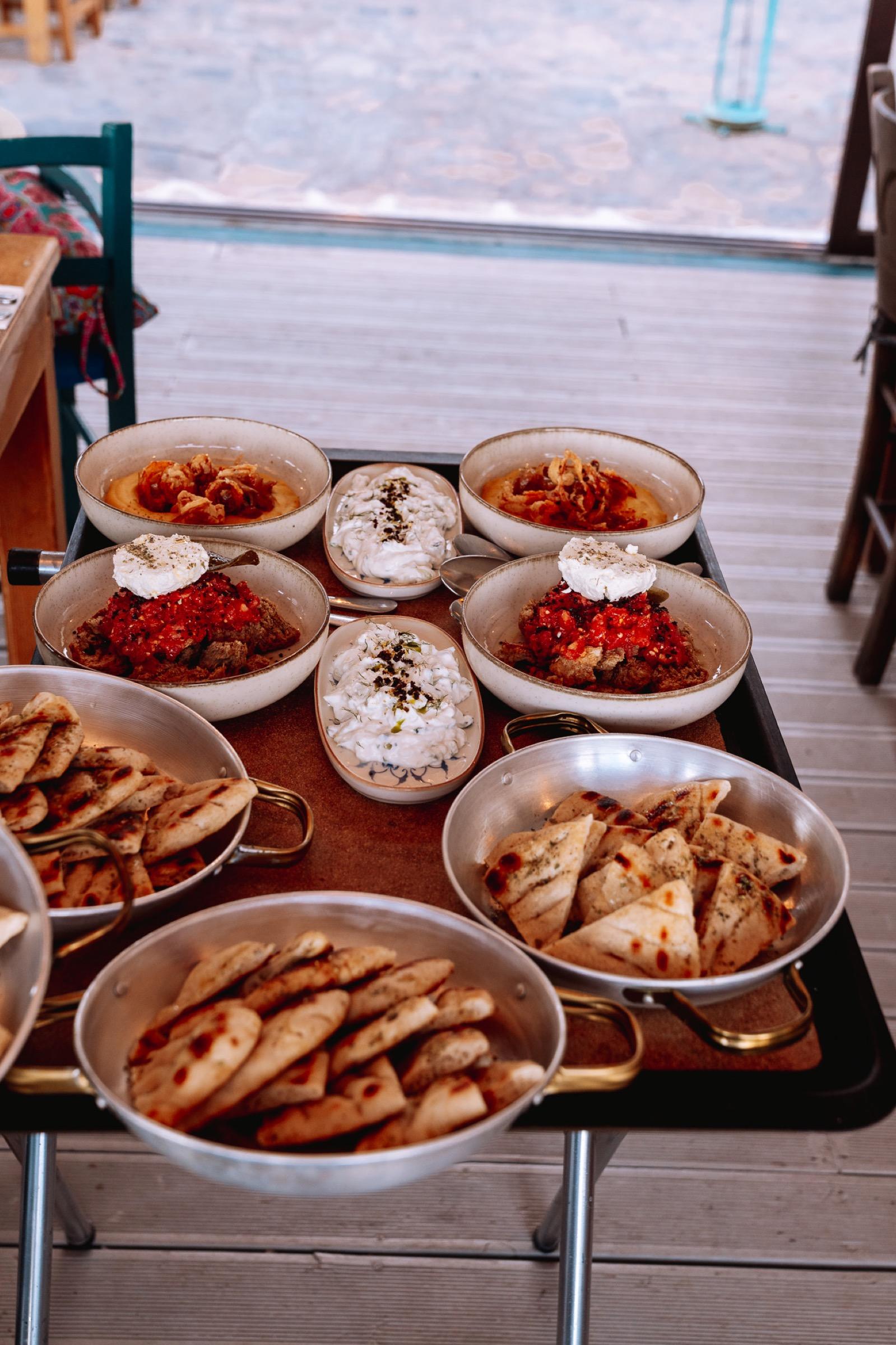 Shared plates at a taverna by the water