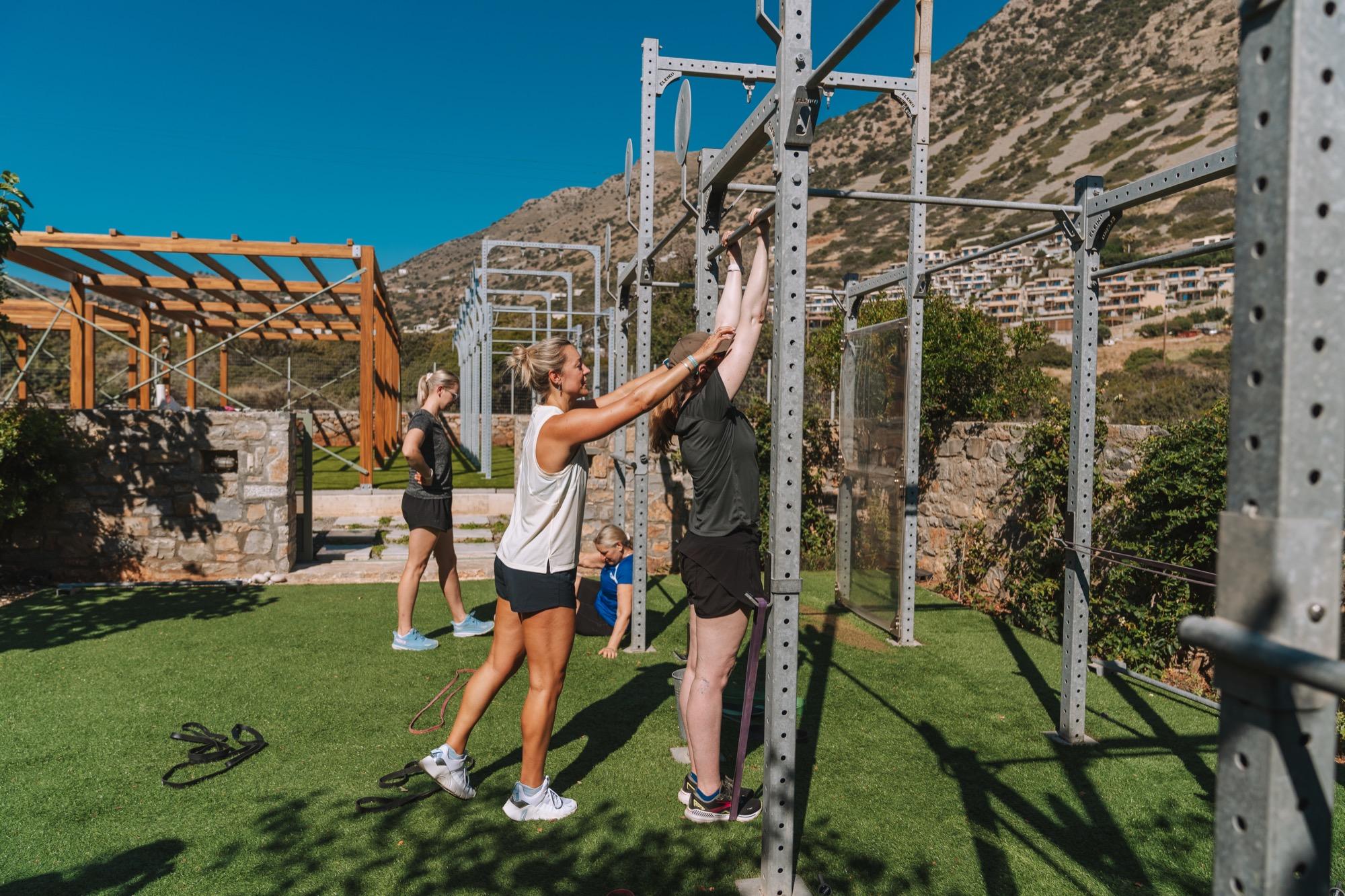 The community training together on the rig in the open-air gym